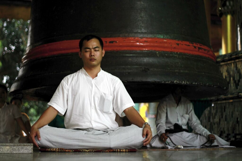 File:Buddhism-meditation-burma.jpg - a man sitting in a meditation position