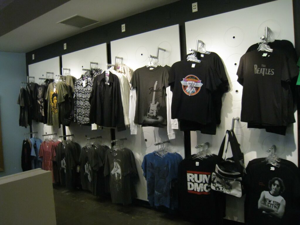 File:Razvan Orendovici - EMP Gift Shop (4170632756).jpg - a display of shirts and t - shirts