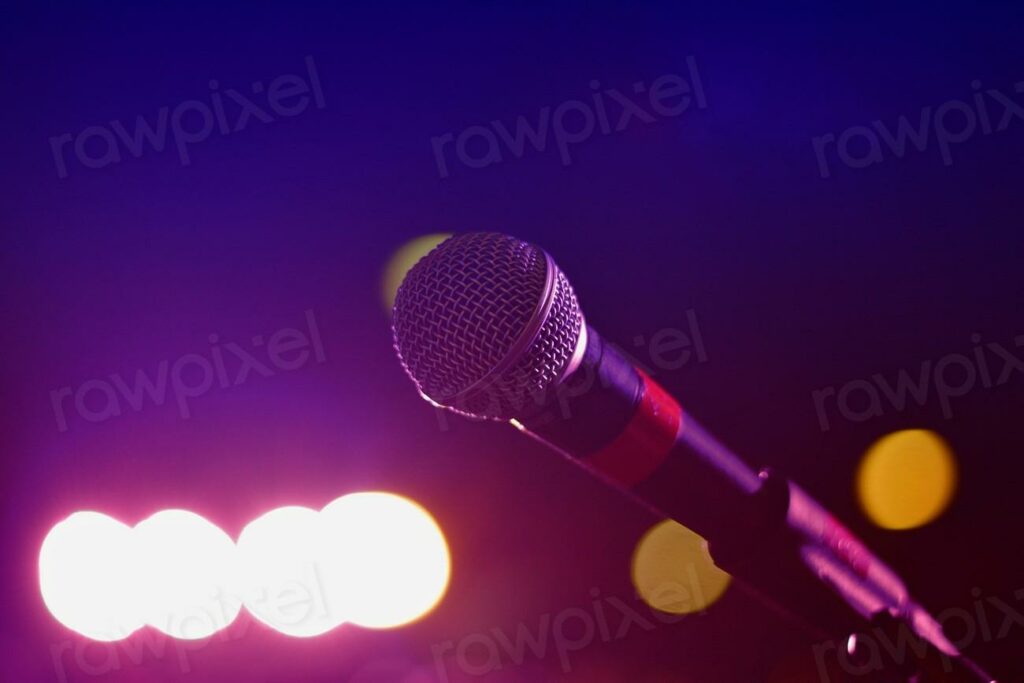 Free microphone image - microphone on stage with lights in the background