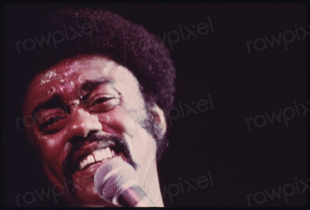 Black Soul Singer Johnny Taylor - a man with a microphone and a microphone in his hand