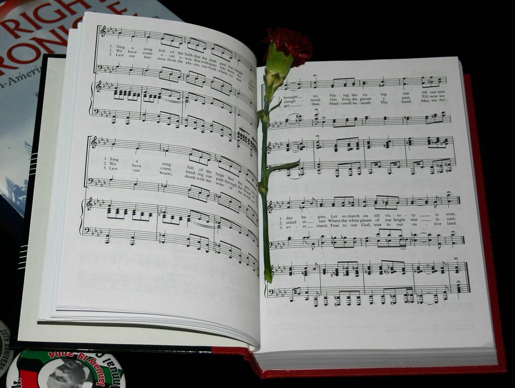 File:Lift Every Voice and Sing sheet music (cropped).jpg - a book with a rose on top of it