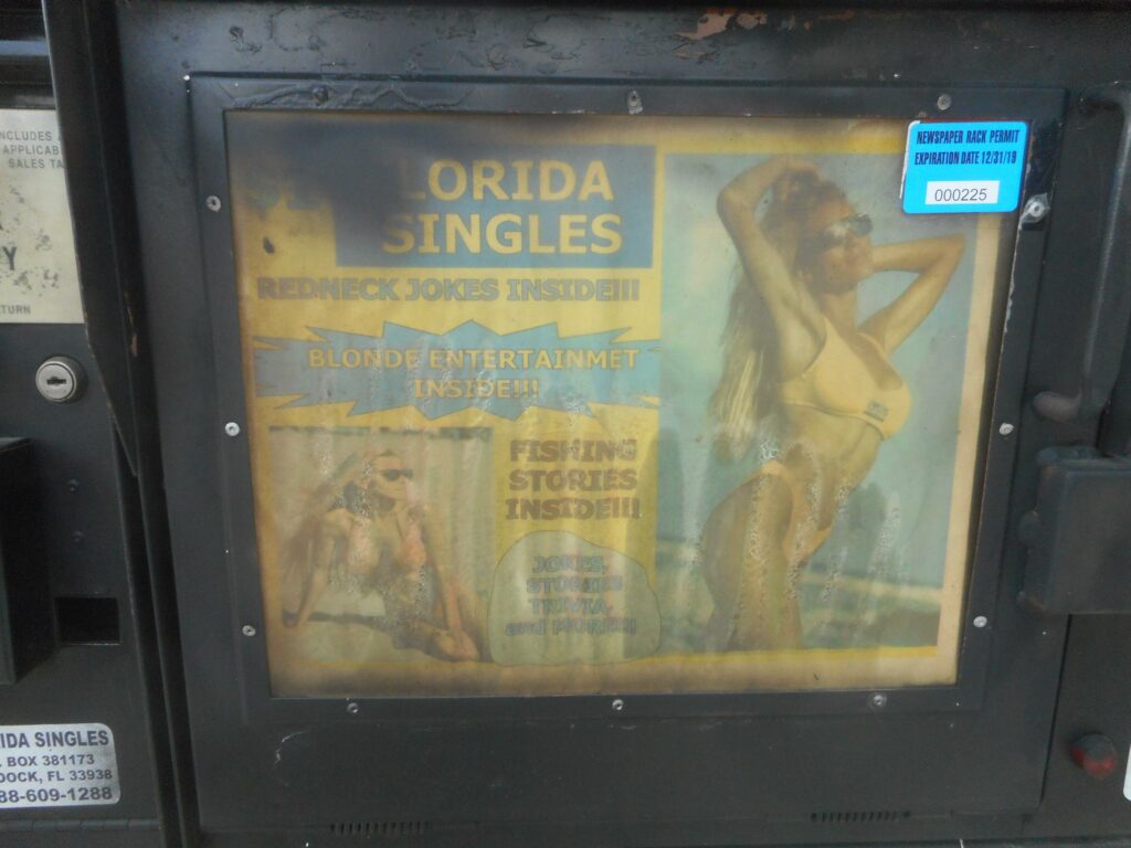 File:WB I-4 Seminole Co Rest Area; Fake Singles Ad Vendor-3.jpg - a poster on a gas station