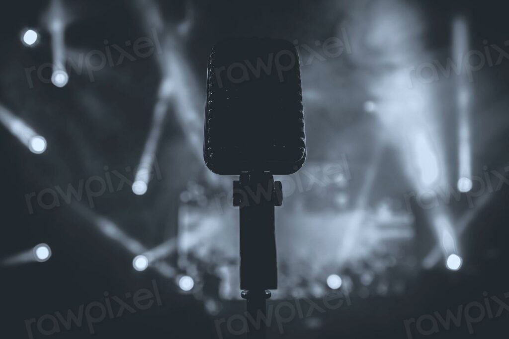 Free microphone concert image - microphone on stage with spotlights in the background